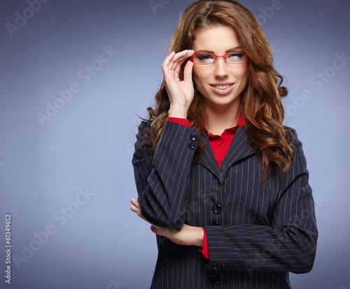 Photo: Cute young business woman with glasses Cute young business woman with glasses