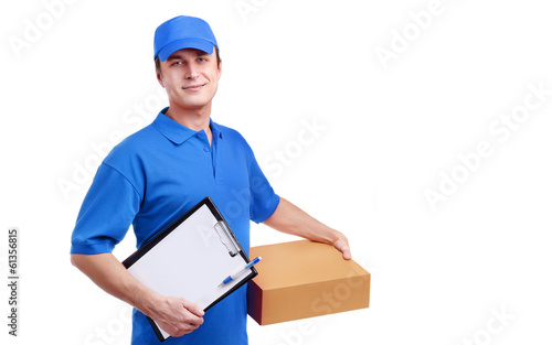 Photo: Young man courier in blue uniform Young man courier in blue uniform