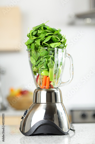 Photo: Green vegetable smoothie in blender Green vegetable smoothie in blender