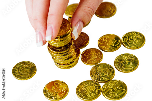 Photo: Frau mit Münzstapel beim Geld sparen Frau mit Münzstapel beim Geld sparen