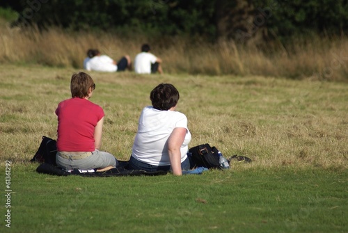 Photo: women sitting relaxing women sitting relaxing