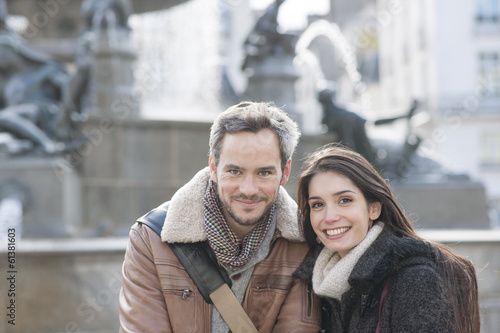 Photo: handsome couple portrait with fountain in background handsome couple portrait with fountain in background