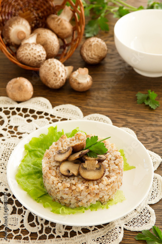 Photo: Buckwheat porridge with mushrooms on plate Buckwheat porridge with mushrooms on plate