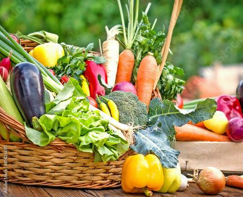Photo: Fresh organic vegetables in wicker basket Fresh organic vegetables in wicker basket