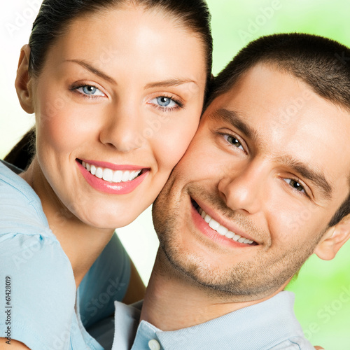 Photo: Young happy smiling attractive couple, outdoors Young happy smiling attractive couple, outdoors