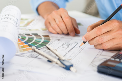 Photo: Draftsman Drawing Blueprints Draftsman Drawing Blueprints