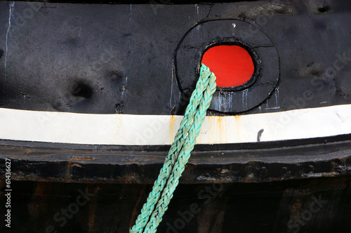 Photo: tug ship docked with rope tug ship docked with rope
