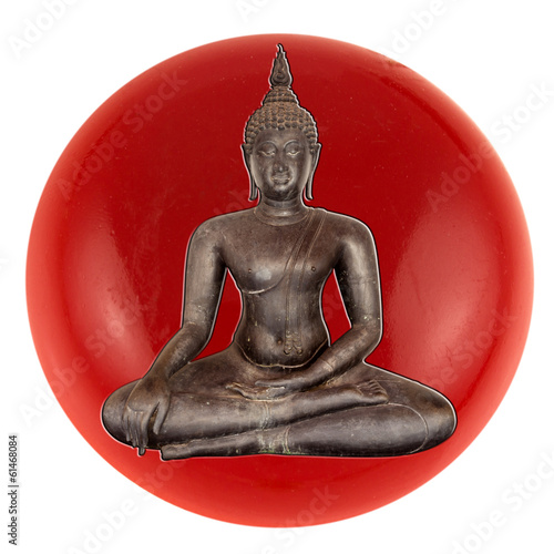 Photo: bouddha noir incrusté dans bouton rouge bouddha noir incrusté dans bouton rouge