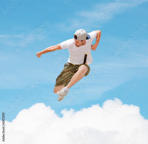 Photo: male dancer jumping in the air male dancer jumping in the air