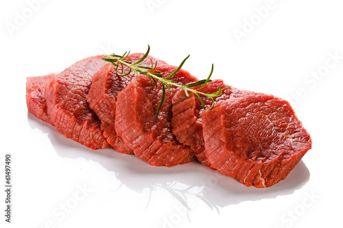 Photo: Raw beef on white background Raw beef on white background