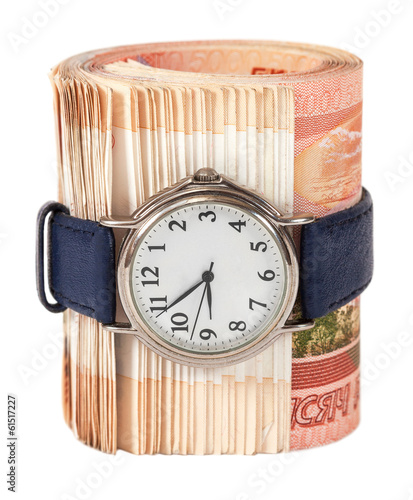 Photo: Russian rubles bills wrapped by belt with watch isolated on whit Russian rubles bills wrapped by belt with watch isolated on whit