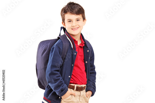 Photo: School boy with backpack standing and looking at camera School boy with backpack standing and looking at camera