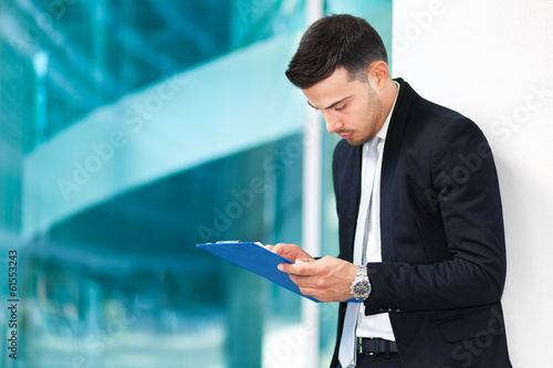 Photo: Businessman reading some documents Businessman reading some documents