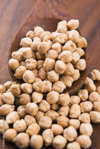 Photo: dried white chickpeas ceci on the wooden spoon dried white chickpeas ceci on the wooden spoon