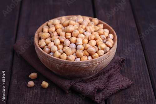 Photo: dry chickpeas in a bowl on the table dry chickpeas in a bowl on the table