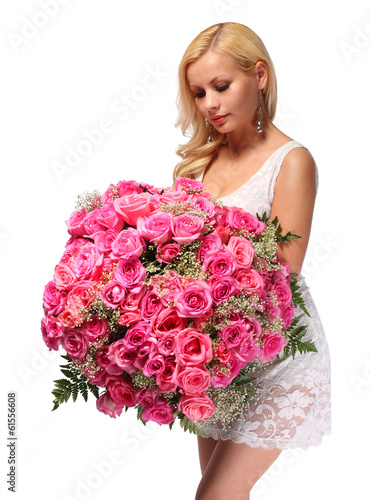 Photo: Blonde Girl with Huge Bouquet of Roses. Beautiful Young Woman Blonde Girl with Huge Bouquet of Roses. Beautiful Young Woman