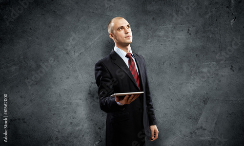 Photo: Man with tablet pc Man with tablet pc