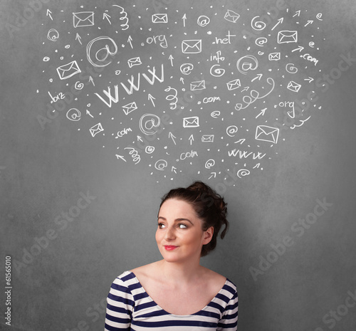 Photo: Young woman thinking with social network icons above her head Young woman thinking with social network icons above her head