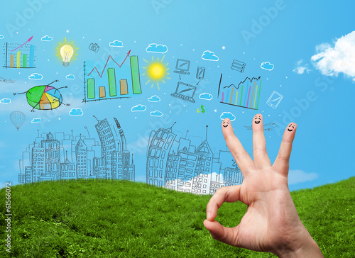 Photo: Happy smiley fingers looking at hand drawn urban city landscape Happy smiley fingers looking at hand drawn urban city landscape
