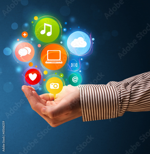 Photo: Multimedia icons in the hand of a businessman Multimedia icons in the hand of a businessman
