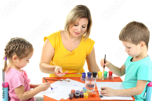 Photo: Little children drawing with mom isolated on white Little children drawing with mom isolated on white
