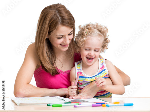 Photo: Mom and child painting together Mom and child painting together