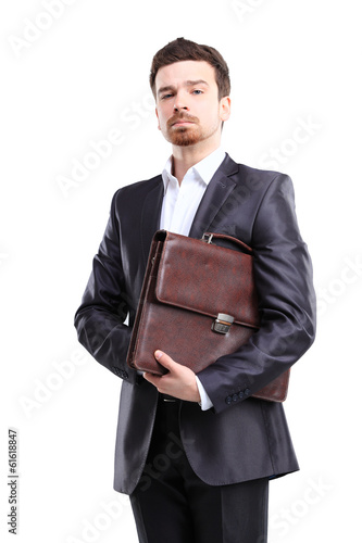 Photo: Business man with briefcase standing on white background Business man with briefcase standing on white background