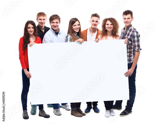 Photo: group of smiling friends holding blank banner group of smiling friends holding blank banner