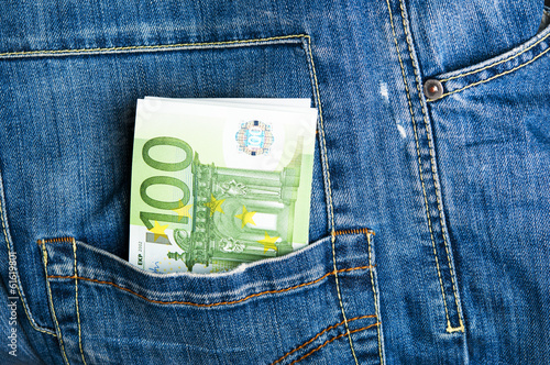 Photo: Pants jeans with euro banknotes in the pocket Pants jeans with euro banknotes in the pocket
