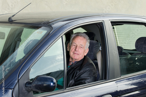 Photo: Old man in car Old man in car
