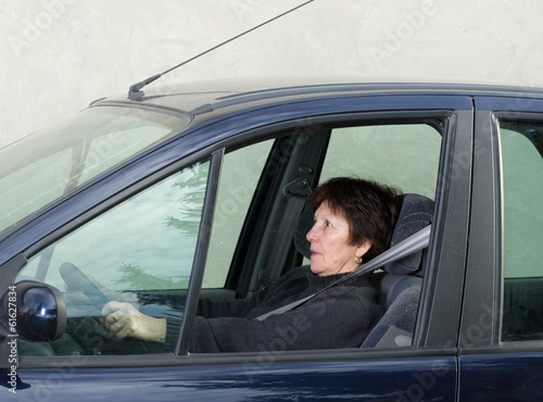 Photo: Scared woman in car Scared woman in car