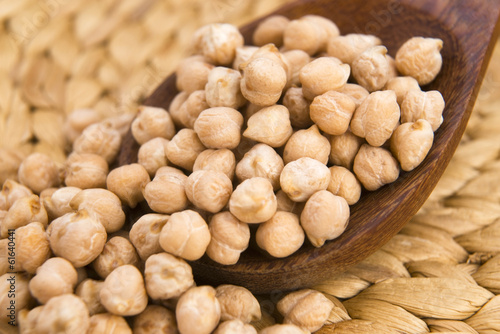 Photo: dried white chickpeas ceci on the wooden spoon dried white chickpeas ceci on the wooden spoon