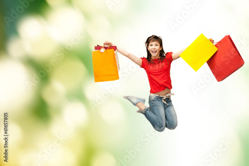 Photo: excited girl with shopping bags excited girl with shopping bags