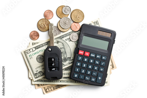 Photo: car key with dollars and calculator car key with dollars and calculator