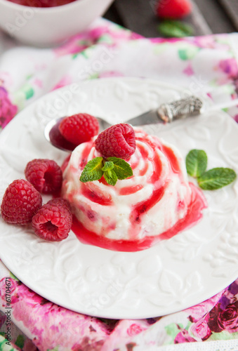 Photo: Delicious dessert with raspberry sauce and fresh berries Delicious dessert with raspberry sauce and fresh berries