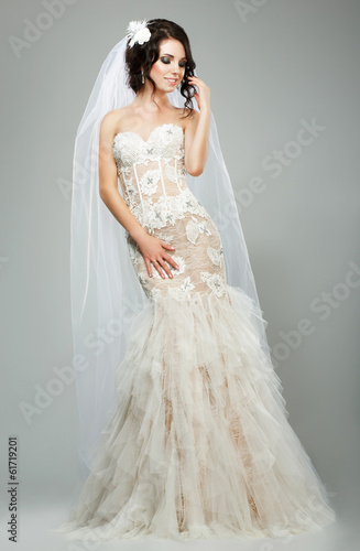 Photo: Wedding. Bride Fashion Model in Sleeveless White Bridal Dress Wedding. Bride Fashion Model in Sleeveless White Bridal Dress