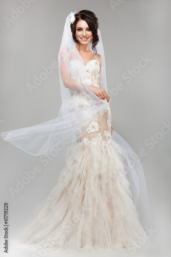 Photo: Expression. Positive Emotions. Smiling Bride in Wedding Dress Expression. Positive Emotions. Smiling Bride in Wedding Dress