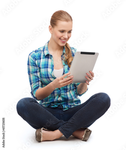 Photo: young woman in casual clothes sitting on floor young woman in casual clothes sitting on floor