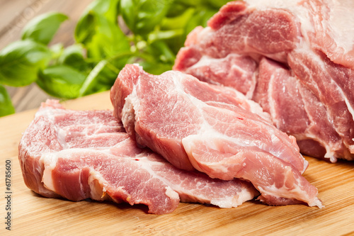 Photo: Raw pork on cutting board Raw pork on cutting board