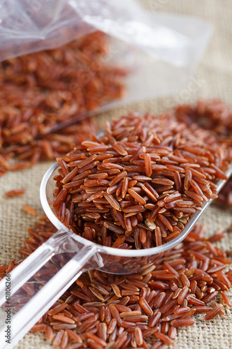 Photo: red rice in a scoop red rice in a scoop