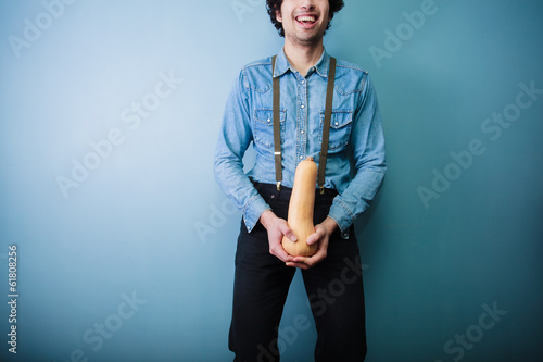 Photo: Happy young farmer holding a squash Happy young farmer holding a squash