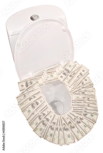 Photo: Money down the toilet bowl (Clipping path) Money down the toilet bowl (Clipping path)