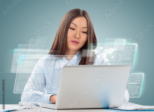 Photo: Attractive businesswoman against hightech background Attractive businesswoman against hightech background