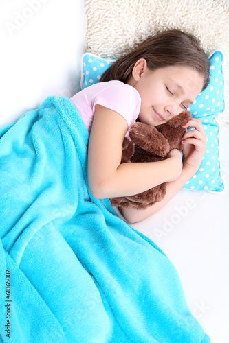 Photo: Beautiful little girl sleeping, close-up Beautiful little girl sleeping, close-up