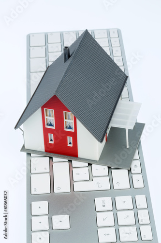 Photo: Wohnhaus auf Tastatur Wohnhaus auf Tastatur