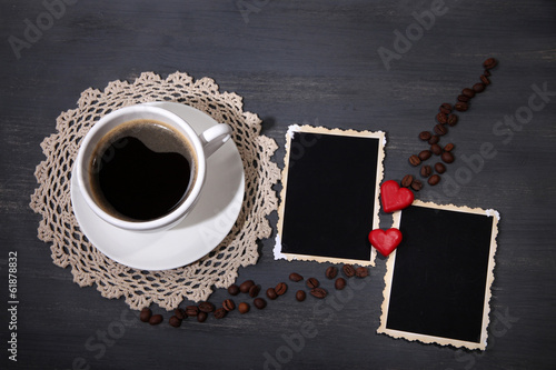 Photo: Composition with coffee cup, decorative hearts and old blank Composition with coffee cup, decorative hearts and old blank