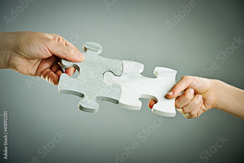 Photo: Kids connecting the jigsaw puzzle Kids connecting the jigsaw puzzle