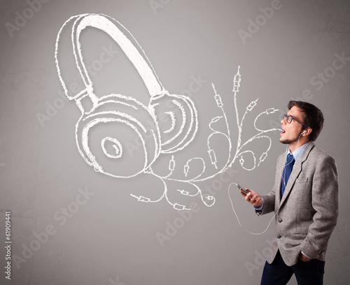 Photo: attractive man singing and listening to music with abstract head attractive man singing and listening to music with abstract head