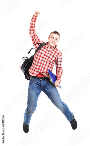Photo: casual young man jumping on white casual young man jumping on white