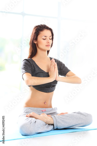 Photo: Fit young female training physically at the gym Fit young female training physically at the gym